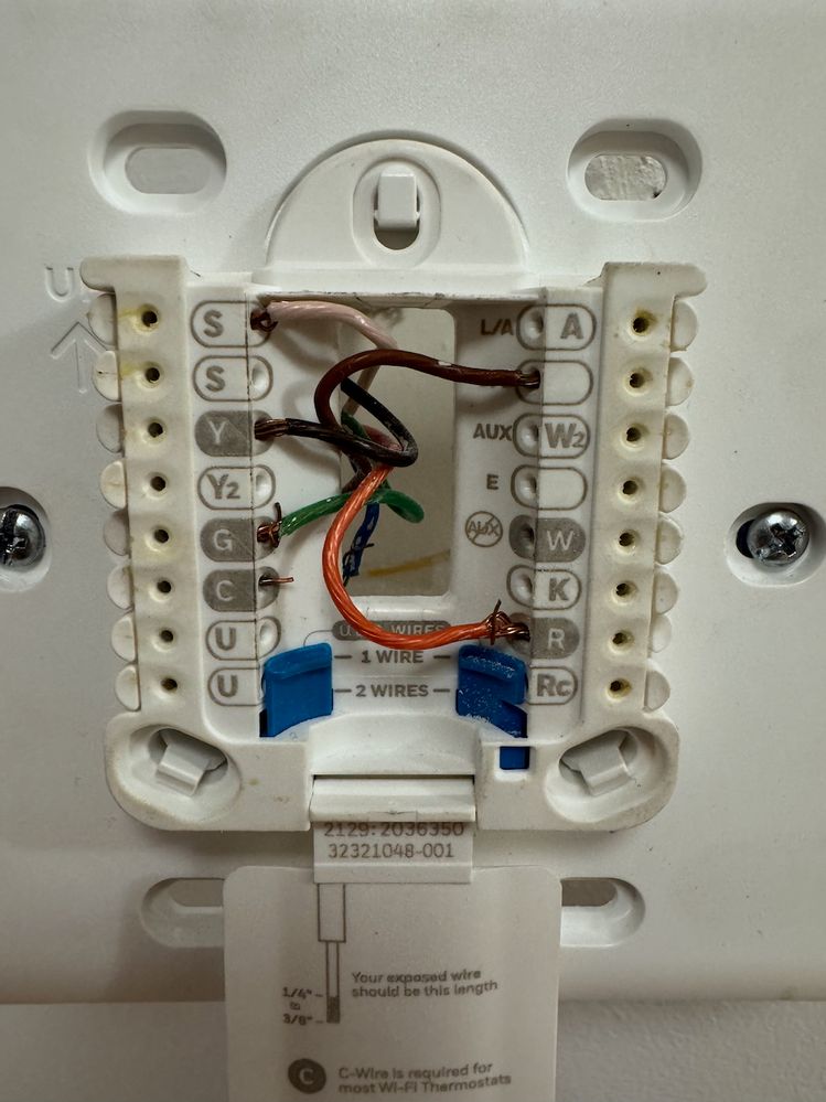 Original Honeywell thermostat. You can see the C wire is disconnected. The thermostat had 2 AA batteries that seemed to be providing power.